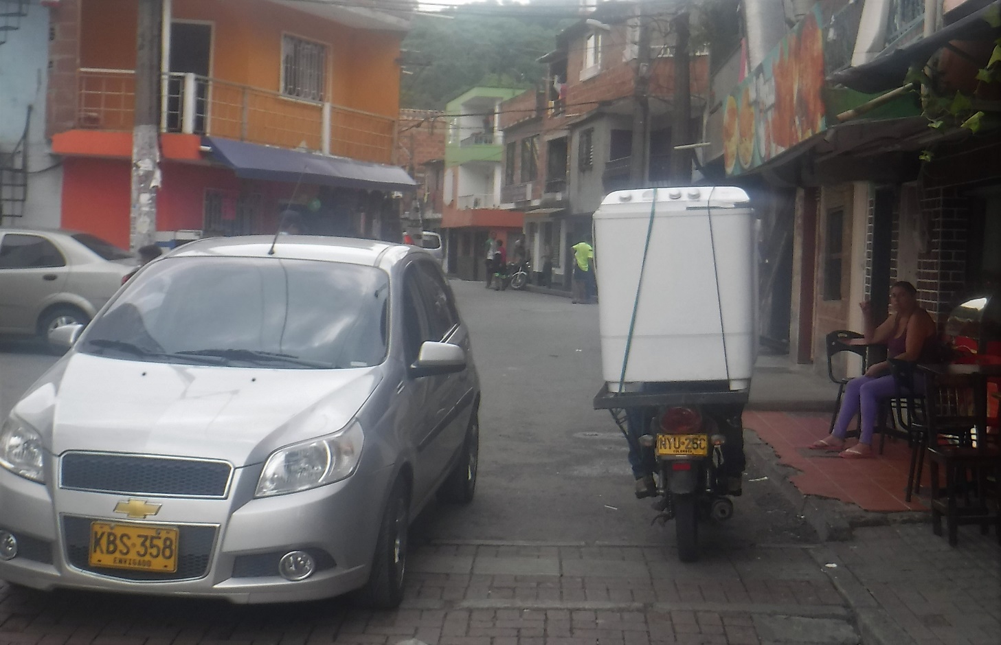 A car parked on a city street Description generated with very high confidence