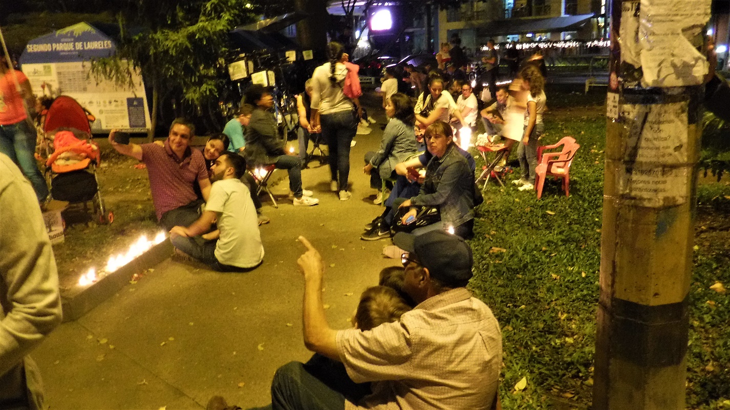 A group of people standing in front of a crowd Description automatically generated