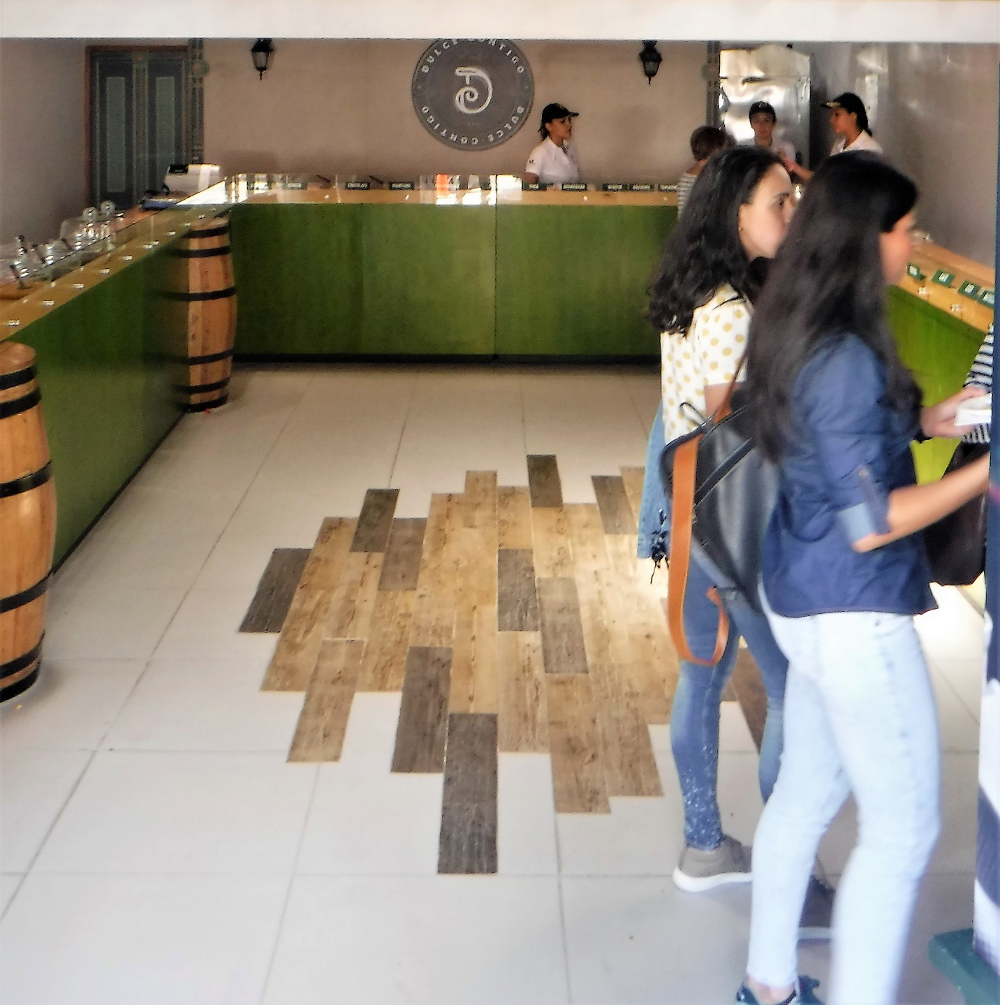 A group of people standing in a room Description automatically generated