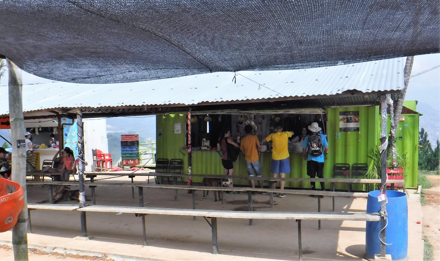 A group of people standing outside of a building Description automatically generated