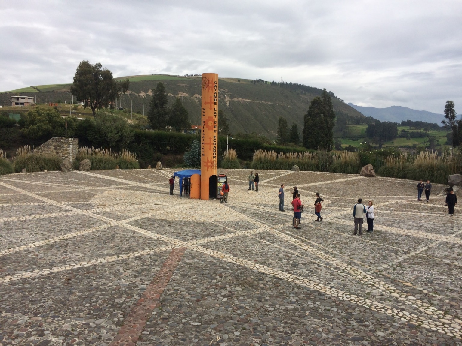 A group of people walking down a dirt road Description automatically generated