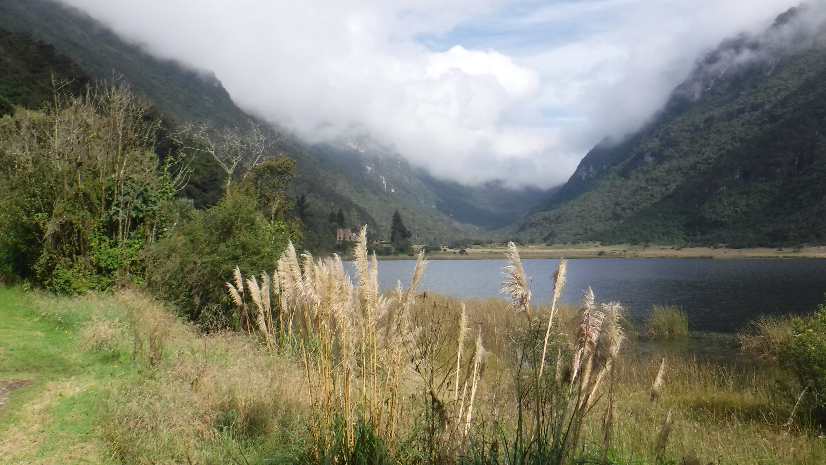 A body of water with a mountain in the background Description automatically generated
