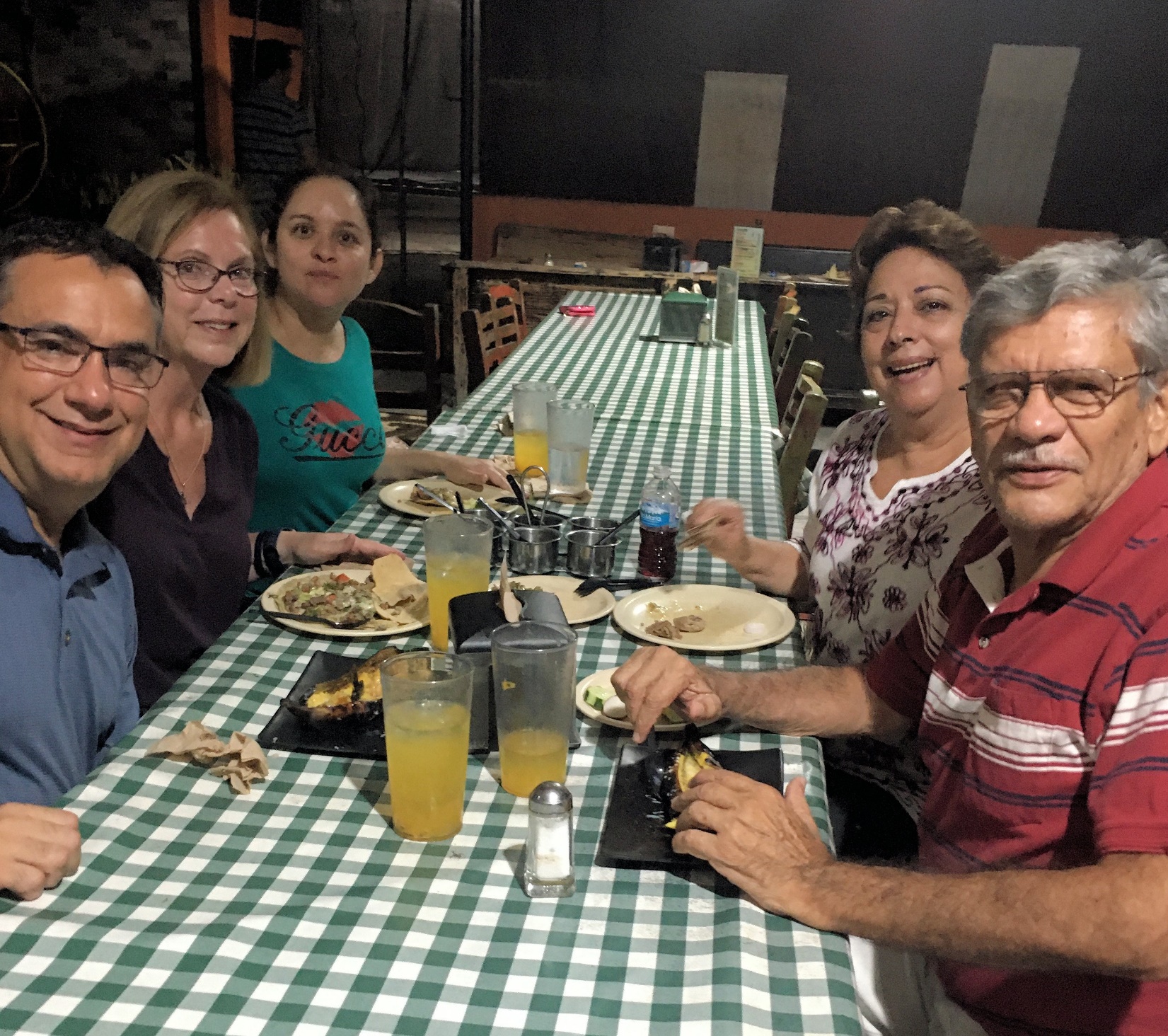 A group of people sitting at a table Description automatically generated