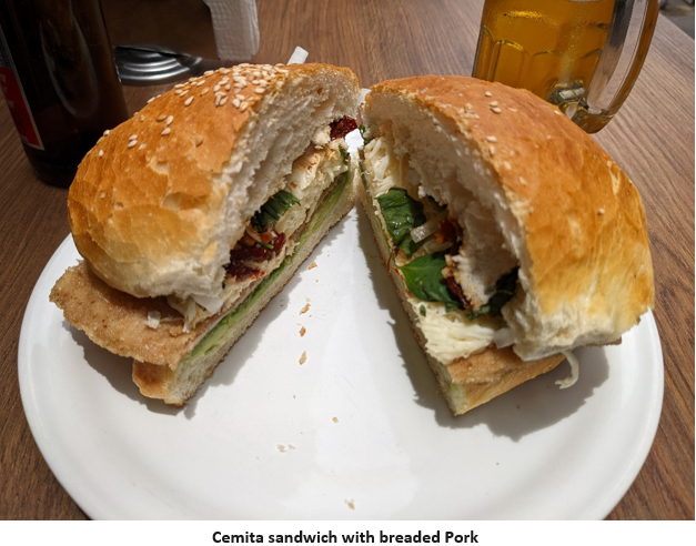 A couple of sandwiches on a plate Description automatically generated with medium confidence