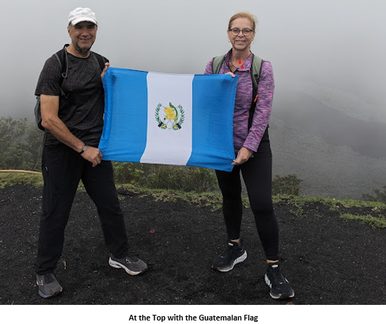A person and person holding a flag Description automatically generated