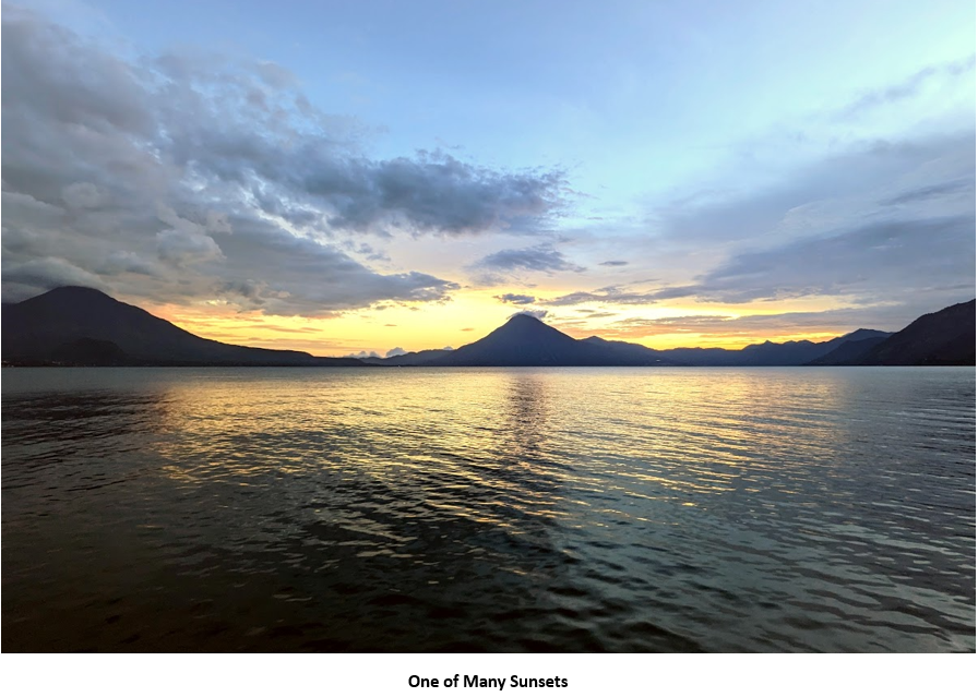 A body of water with mountains in the background Description automatically generated