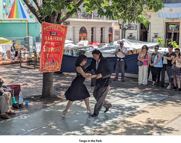 A person and person dancing on a sidewalk Description automatically generated