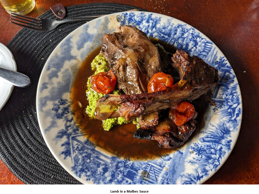 A plate of meat and vegetables Description automatically generated