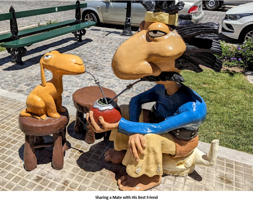 A statue of a person drinking from a straw Description automatically generated
