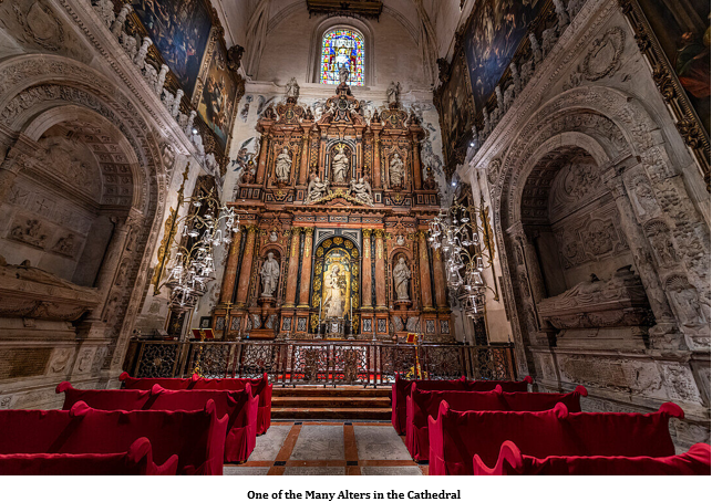 A church with red chairs and a statue Description automatically generated with medium confidence