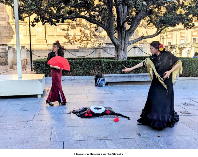 A group of women dancing in the street Description automatically generated