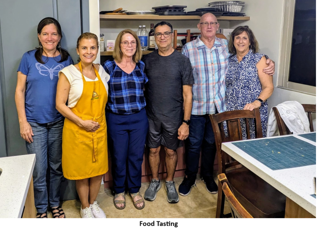 A group of people posing for a photo AI-generated content may be incorrect.